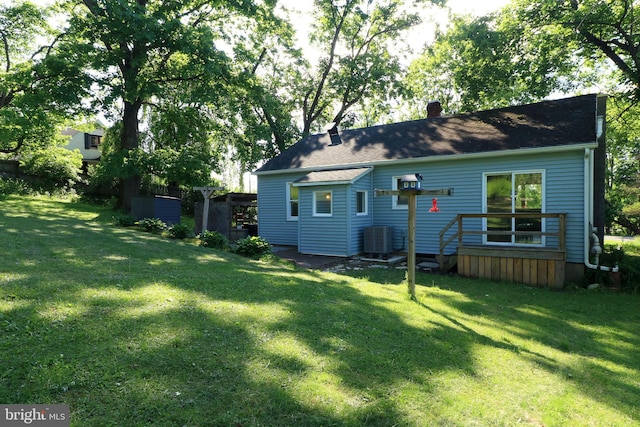 250 E Main St, Millheim, PA 16854 - back of property featuring cooling unit, a chimney, and a lawn