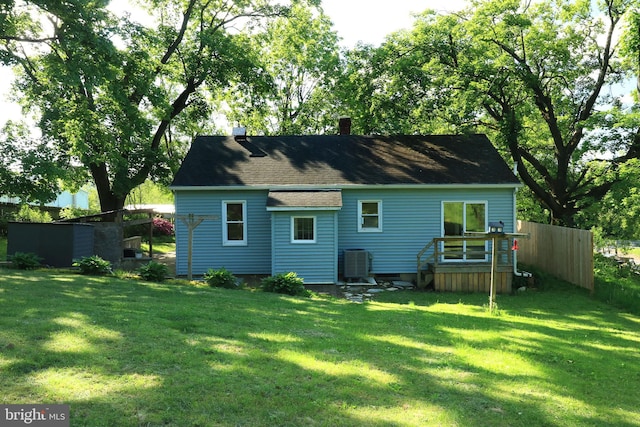 250 E Main St, Millheim, PA 16854 - rear view of property with central air condition unit, a chimney, and roof with shingles
