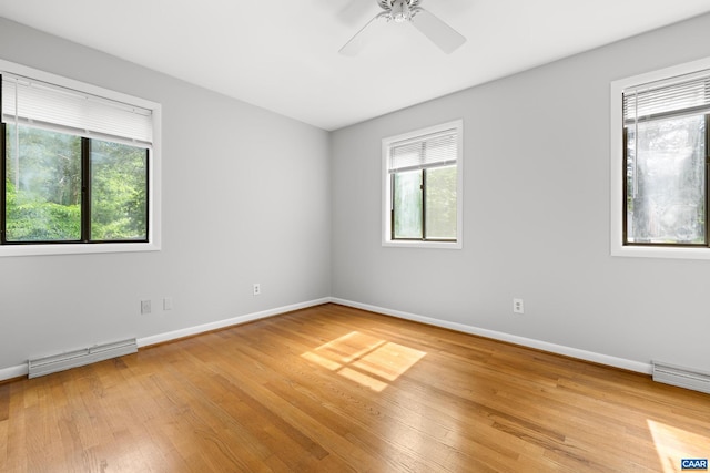 3720 Glenaire Dr, Charlottesville, VA 22901 - unfurnished room with baseboard heating, light wood finished floors, ceiling fan, and baseboards