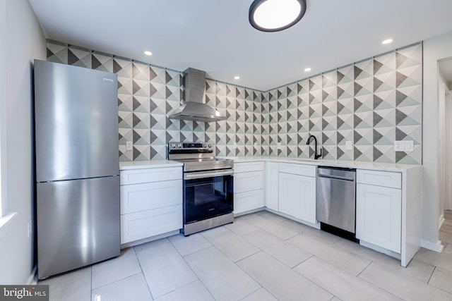 102 S Hawksbill St, Luray, VA 22835 - kitchen with stainless steel appliances, wall chimney range hood, light countertops, tasteful backsplash, and recessed lighting