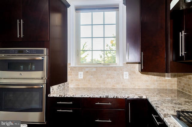 42624 Lisburn Chase Ter, Chantilly, VA 20152 - kitchen with stainless steel double oven, tasteful backsplash, healthy amount of natural light, and dark brown cabinets