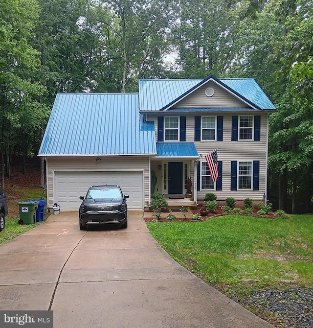 9380 Caucus Dr, King George, VA 22485 - view of front of home with driveway, metal roof, a front yard, and a garage