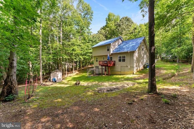 9380 Caucus Dr, King George, VA 22485 - rear view of house featuring a wooden deck and metal roof