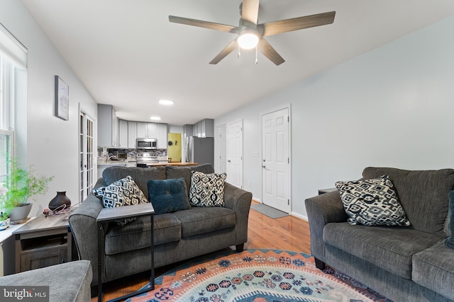 9380 Caucus Dr, King George, VA 22485 - living area with wood finished floors, ceiling fan, baseboards, and recessed lighting