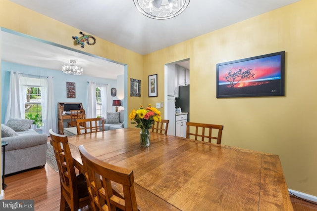 9380 Caucus Dr, King George, VA 22485 - dining space featuring a chandelier and wood finished floors