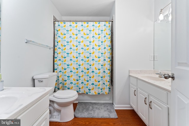 9380 Caucus Dr, King George, VA 22485 - bathroom with vanity, toilet, shower / bath combination with curtain, and wood finished floors