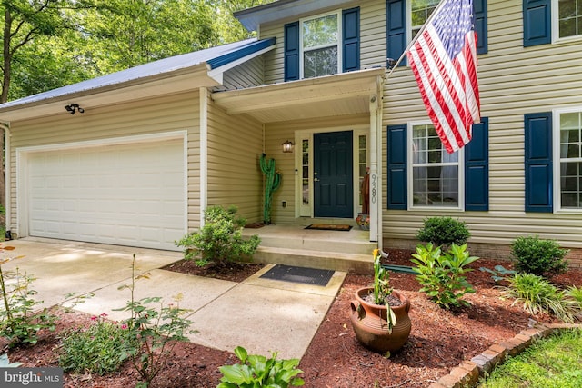 9380 Caucus Dr, King George, VA 22485 - doorway to property with an attached garage and concrete driveway