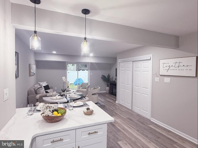 185 La Cascata, Clementon, NJ 08021 - kitchen featuring white cabinets, open floor plan, wood finished floors, and hanging light fixtures