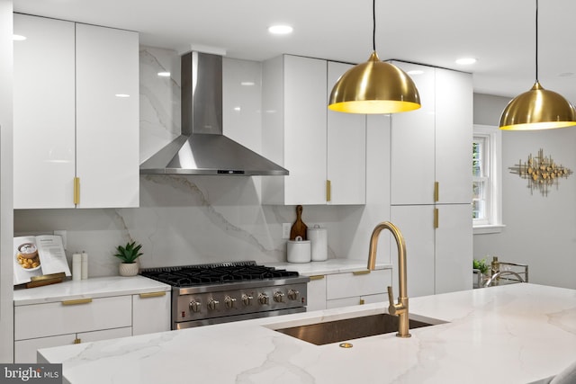 9813 Singleton Dr, Bethesda, MD 20817 - kitchen with wall chimney range hood, stainless steel range with gas cooktop, modern cabinets, and recessed lighting