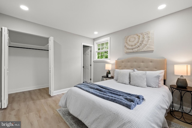 9813 Singleton Dr, Bethesda, MD 20817 - bedroom featuring light wood-style floors, baseboards, a closet, and recessed lighting