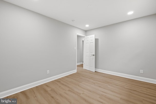 9813 Singleton Dr, Bethesda, MD 20817 - unfurnished room with light wood-style flooring, baseboards, and recessed lighting