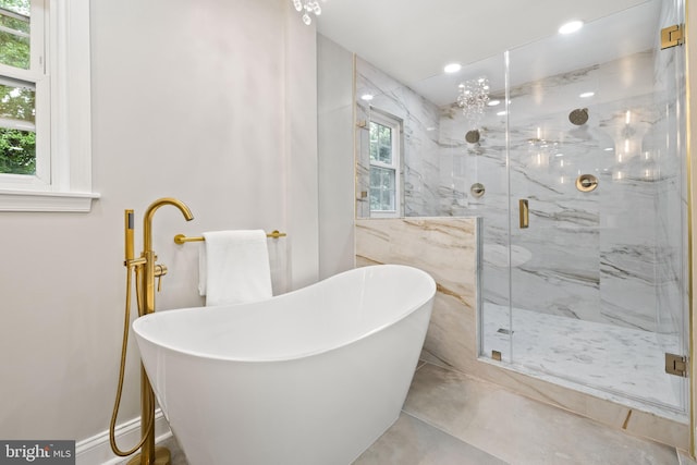 9813 Singleton Dr, Bethesda, MD 20817 - full bath with a marble finish shower, a freestanding bath, a baseboard heating unit, and recessed lighting