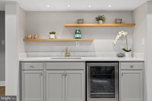 9813 Singleton Dr, Bethesda, MD 20817 - indoor wet bar featuring beverage cooler and recessed lighting
