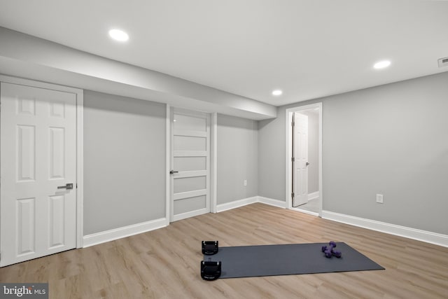 9813 Singleton Dr, Bethesda, MD 20817 - exercise room with wood finished floors, baseboards, and recessed lighting