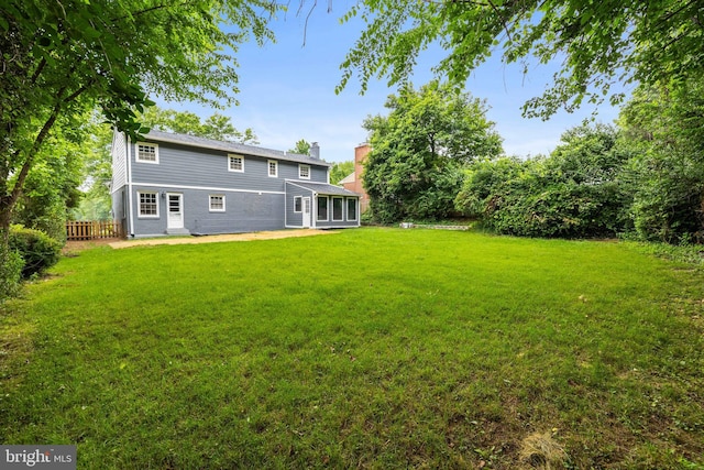 9813 Singleton Dr, Bethesda, MD 20817 - back of house featuring a chimney and a patio area