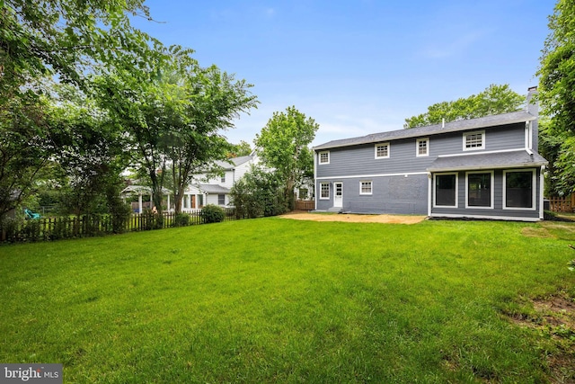 9813 Singleton Dr, Bethesda, MD 20817 - back of house featuring a chimney and a patio