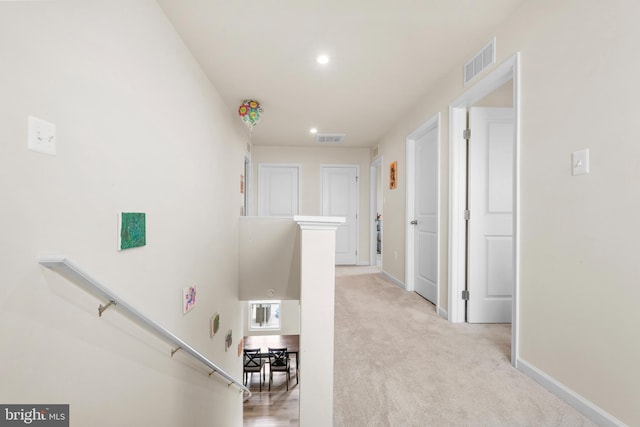 140 Mariners Way, Cambridge, MD 21613 - hall with an upstairs landing, baseboards, recessed lighting, and light colored carpet