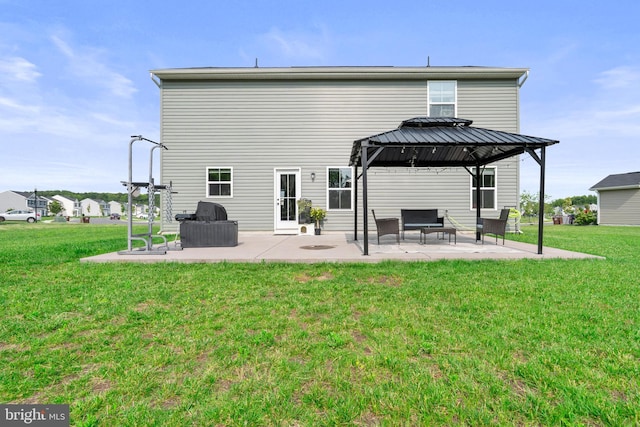 140 Mariners Way, Cambridge, MD 21613 - rear view of property featuring a gazebo, a patio area, and a lawn