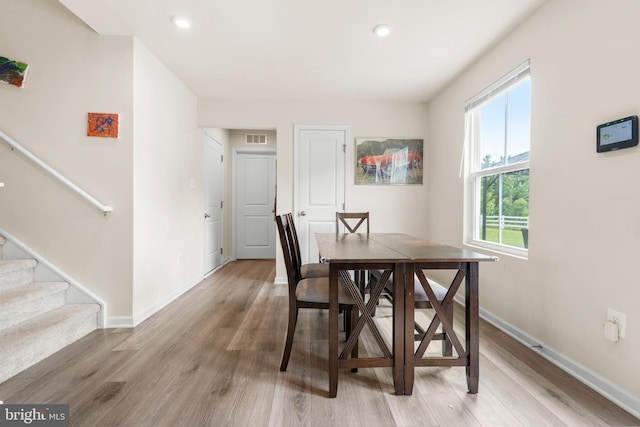 140 Mariners Way, Cambridge, MD 21613 - dining room featuring light wood-style flooring, baseboards, stairway, and recessed lighting