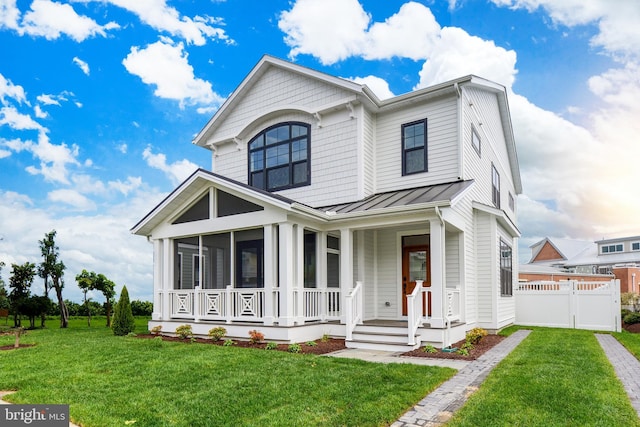 114 Jersey St, Dewey Beach, DE 19971 - view of front of property with a standing seam roof, metal roof, a sunroom, and covered porch