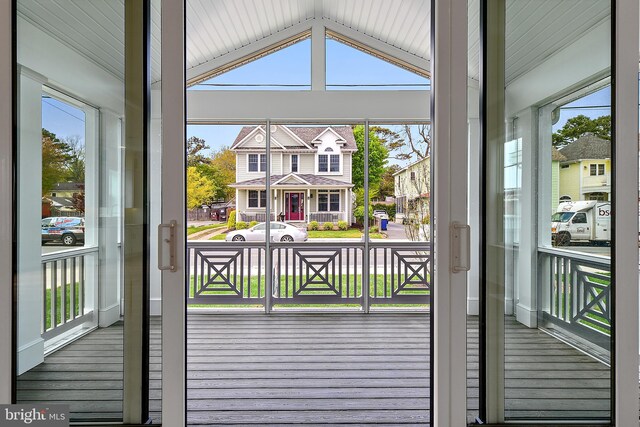 114 Jersey St, Dewey Beach, DE 19971 - entryway featuring healthy amount of natural light, wood finished floors, and vaulted ceiling