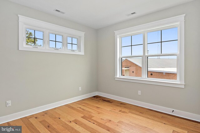 114 Jersey St, Dewey Beach, DE 19971 - unfurnished room featuring plenty of natural light, baseboards, and light wood-type flooring