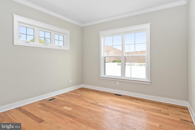 114 Jersey St, Dewey Beach, DE 19971 - empty room featuring ornamental molding, baseboards, and light wood-style flooring