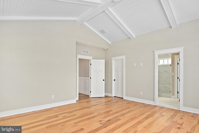 114 Jersey St, Dewey Beach, DE 19971 - unfurnished bedroom featuring light wood-type flooring, beam ceiling, baseboards, high vaulted ceiling, and ensuite bath