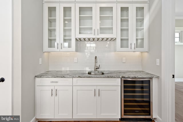 114 Jersey St, Dewey Beach, DE 19971 - indoor wet bar with beverage cooler, tasteful backsplash, and baseboards