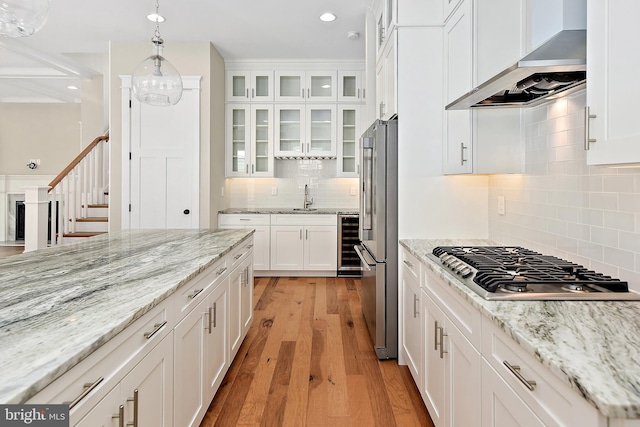 114 Jersey St, Dewey Beach, DE 19971 - kitchen featuring wall chimney range hood, wine cooler, stainless steel appliances, white cabinets, and recessed lighting