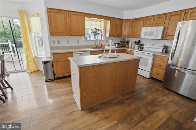 134 Cobblestone Dr, Gilbertsville, PA 19525 - kitchen with white appliances, a sink, light countertops, and wood finished floors
