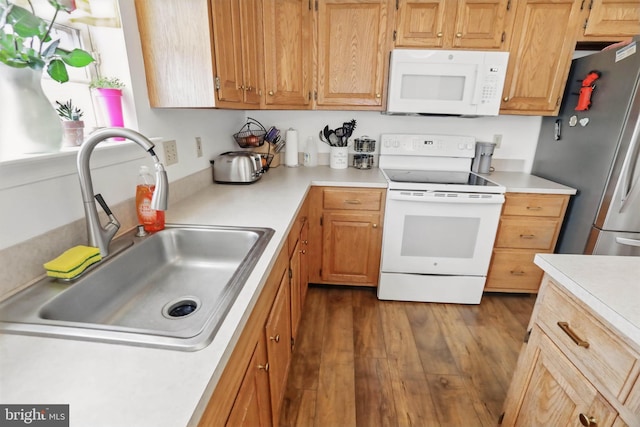134 Cobblestone Dr, Gilbertsville, PA 19525 - kitchen with white appliances, a sink, light countertops, and dark wood-type flooring