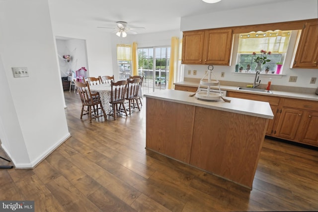 134 Cobblestone Dr, Gilbertsville, PA 19525 - kitchen featuring a sink, light countertops, a ceiling fan, dark wood-type flooring, and brown cabinetry