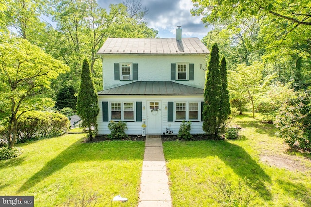 951 Little Conestoga Rd, Glenmoore, PA 19343 - view of front of house with a standing seam roof, a front lawn, and metal roof