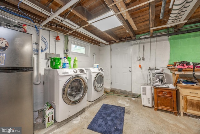 951 Little Conestoga Rd, Glenmoore, PA 19343 - laundry room with washer and clothes dryer and concrete block wall