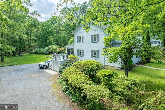 951 Little Conestoga Rd, Glenmoore, PA 19343 - view of front facade featuring gravel driveway, a front lawn, a deck, and a garage