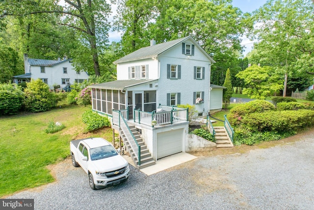 951 Little Conestoga Rd, Glenmoore, PA 19343 - view of front facade with stairway, a sunroom, driveway, and metal roof