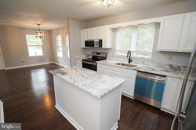 11699 Norris Twilley Rd, Sharptown, MD 21861 - kitchen featuring stainless steel appliances, a sink, dark wood-style flooring, and a kitchen island