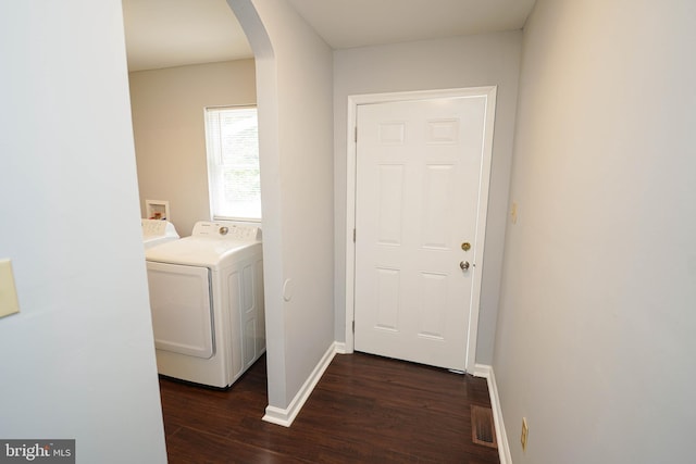 11699 Norris Twilley Rd, Sharptown, MD 21861 - laundry room with arched walkways, washing machine and clothes dryer, dark wood-style floors, and baseboards