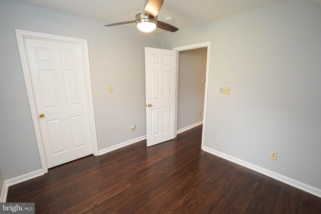 11699 Norris Twilley Rd, Sharptown, MD 21861 - unfurnished bedroom with dark wood-style flooring, baseboards, and ceiling fan