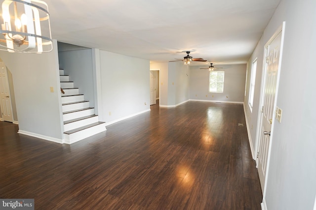 11699 Norris Twilley Rd, Sharptown, MD 21861 - unfurnished living room with stairs, a ceiling fan, dark wood-style flooring, a chandelier, and baseboards