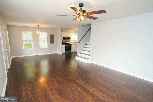 11699 Norris Twilley Rd, Sharptown, MD 21861 - unfurnished living room with baseboards, stairway, dark wood-type flooring, and electric panel