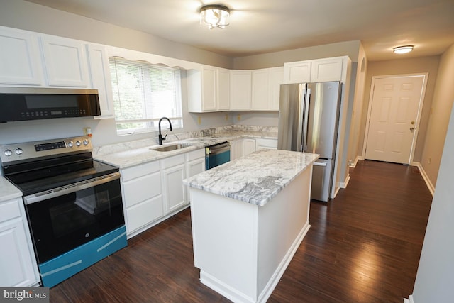 11699 Norris Twilley Rd, Sharptown, MD 21861 - kitchen with appliances with stainless steel finishes, a sink, light stone countertops, and white cabinetry