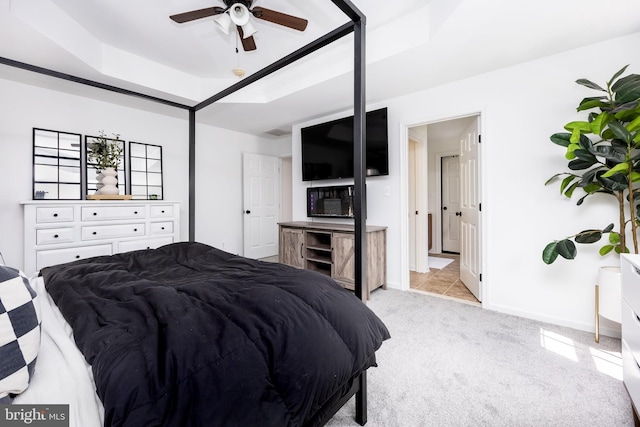 9177 Drawbridge Dr, Delmar, MD 21875 - carpeted bedroom with a raised ceiling, baseboards, and a ceiling fan