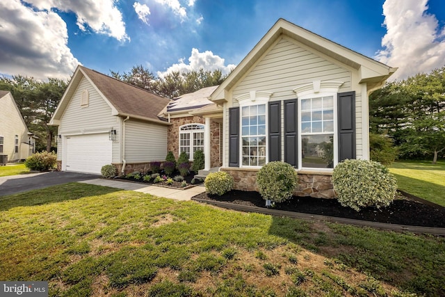 9177 Drawbridge Dr, Delmar, MD 21875 - view of front of home with stone siding, driveway, and a front yard