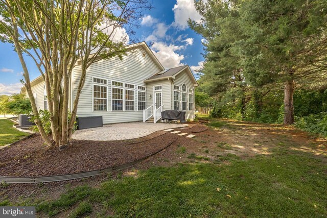 9177 Drawbridge Dr, Delmar, MD 21875 - back of house featuring a patio area, entry steps, and a yard
