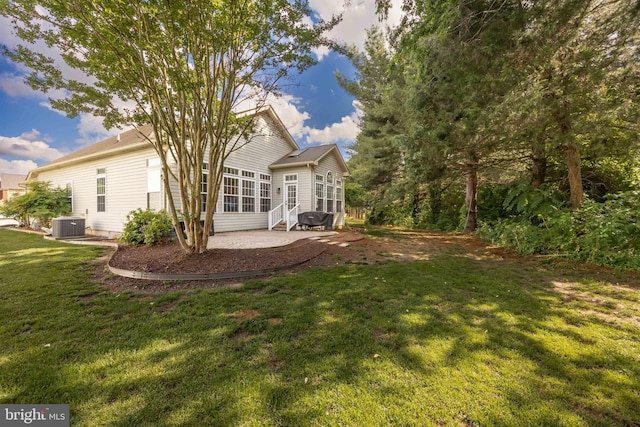 9177 Drawbridge Dr, Delmar, MD 21875 - rear view of property with a patio, a lawn, entry steps, and central air condition unit