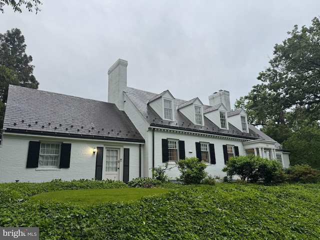 101 E Highfield Rd, Baltimore, MD 21218 - cape cod house with brick siding, a chimney, and a high end roof