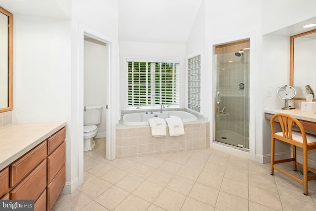 full bath featuring tile patterned flooring, a stall shower, toilet, a bath, and vanity