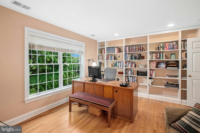 office space featuring light wood-style floors and baseboards